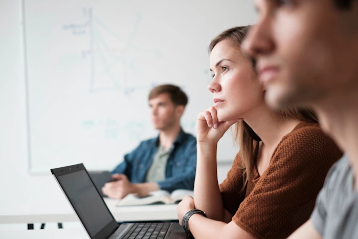 students-in-class-with-open-laptops
