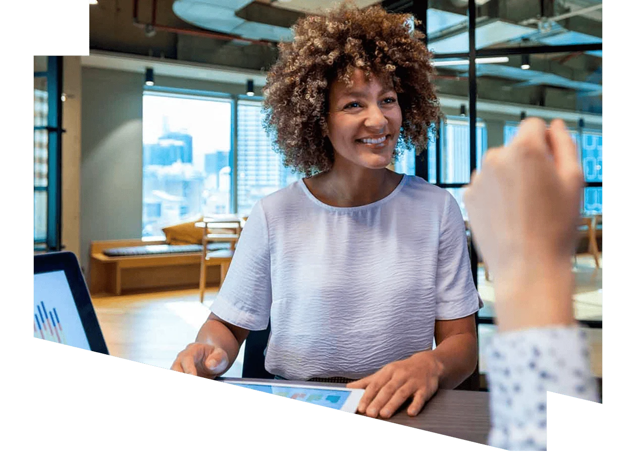 Woman discussing data with a colleague