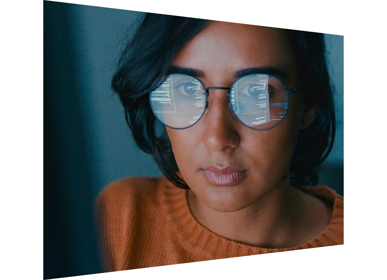 Woman looking at screen with data superimposed on the image