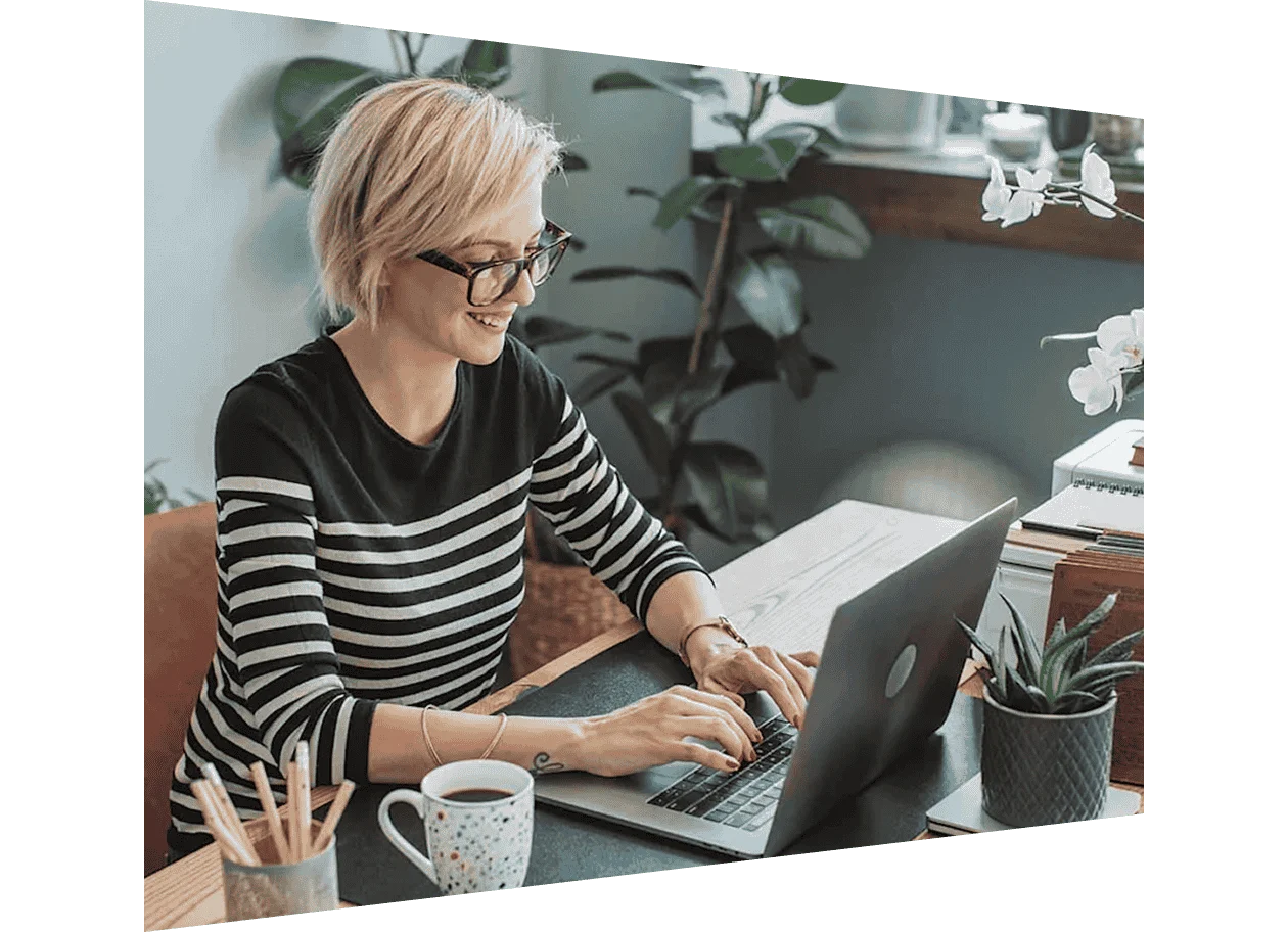 Female author working on laptop in office