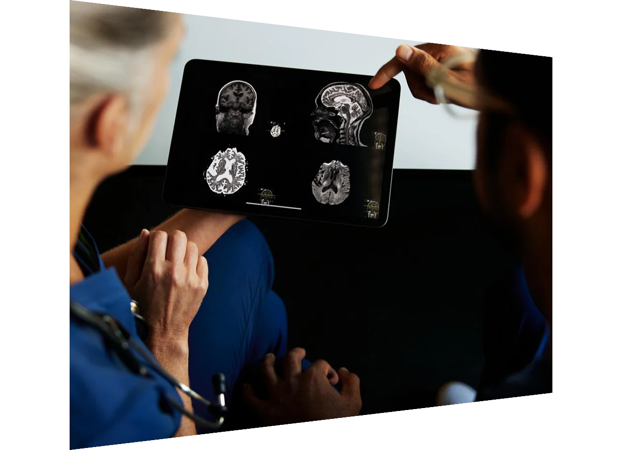 Male nurse reviews education content with female patient in hospital