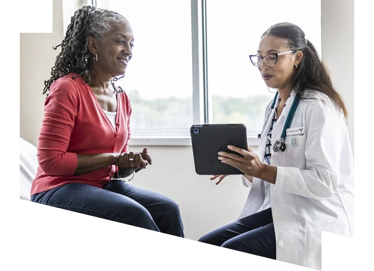 Stock image depicting a female physician showing a tablet to a patient (Source: MoMo Productions/DigitalVision via Getty Images)